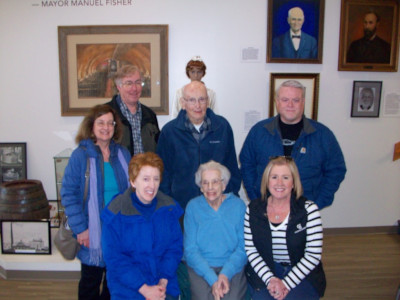 Members of the Kamm family by the Kamm Family exhibit at the MHM dedication